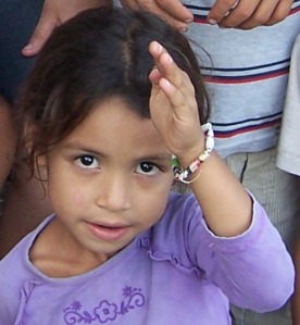 A Daisy-aged girl with her bracelet.